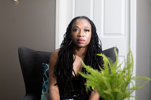 Beautiful model with long flowing thin dreadlocks.
