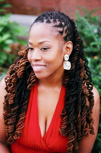 Woman with curly dreadlocks.
