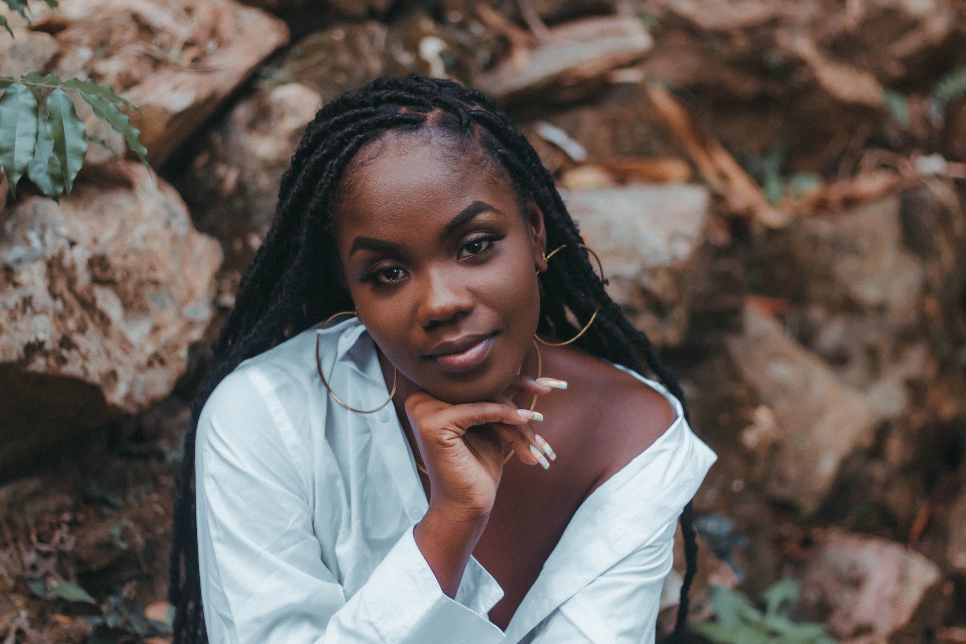 Woman with dreadlocks looking at the camera